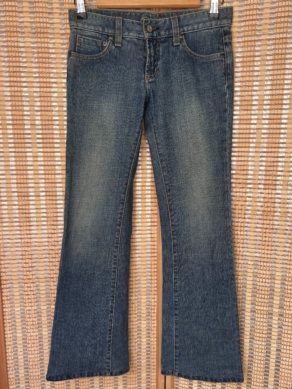 Y2K light/medium wash Bebe low rise flare jeans with rhinestone logo on back